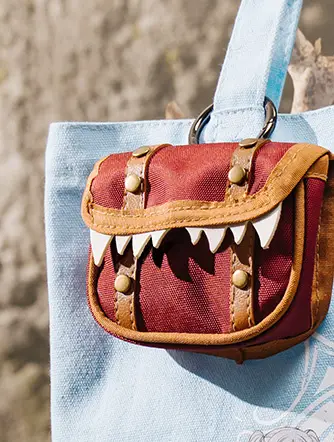 Close-up of mimic charm pouch on Frieren Edition canvas tote bag