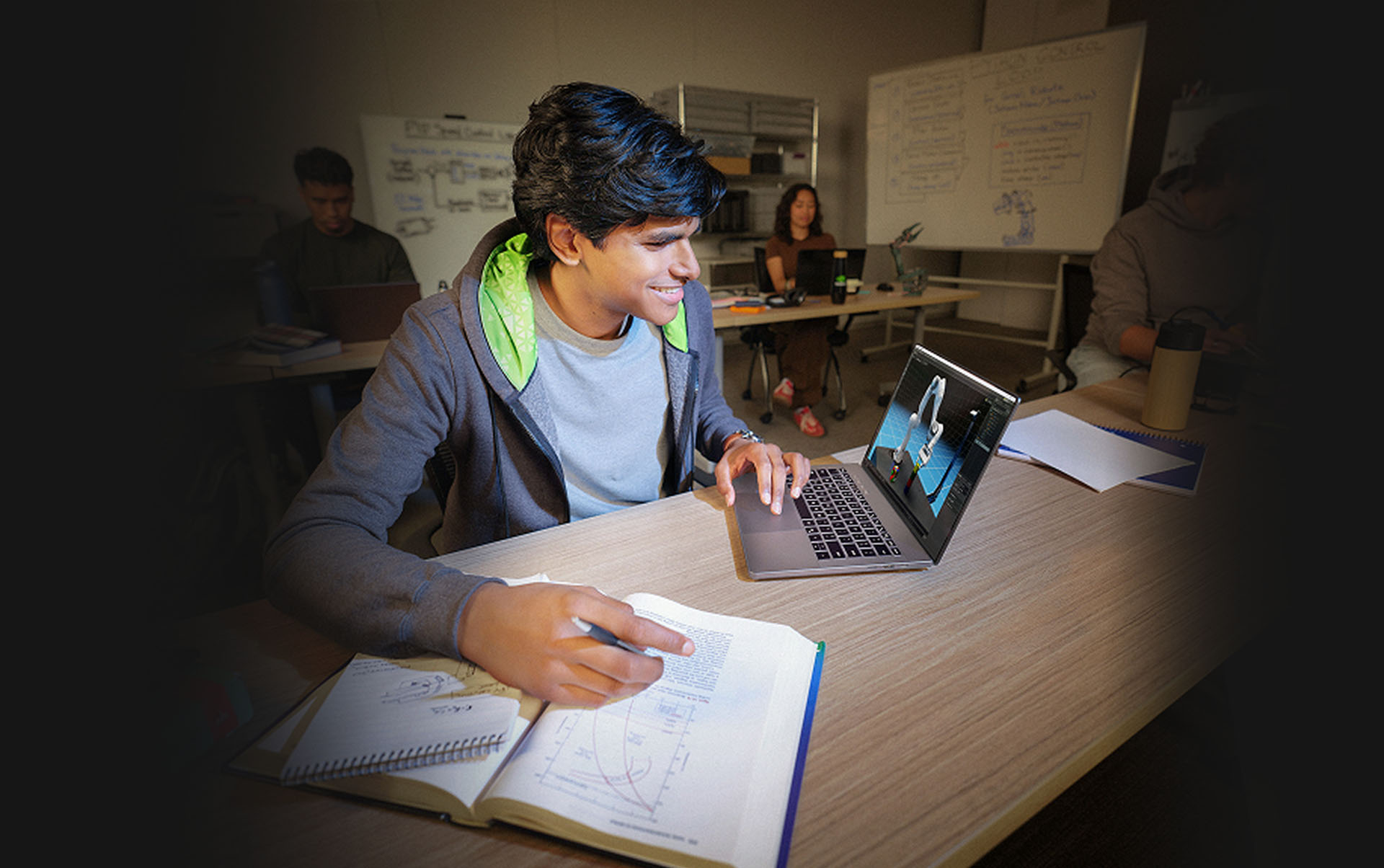 Student using MSI laptop for 3D modeling in engineering class