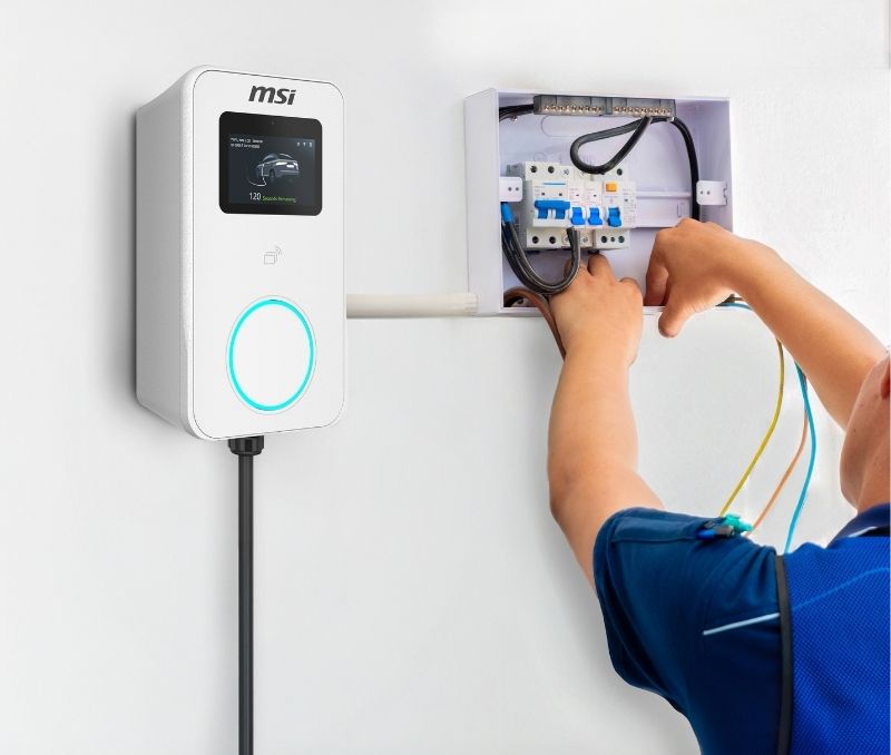 Certified MSI installer performing charger setup and service.