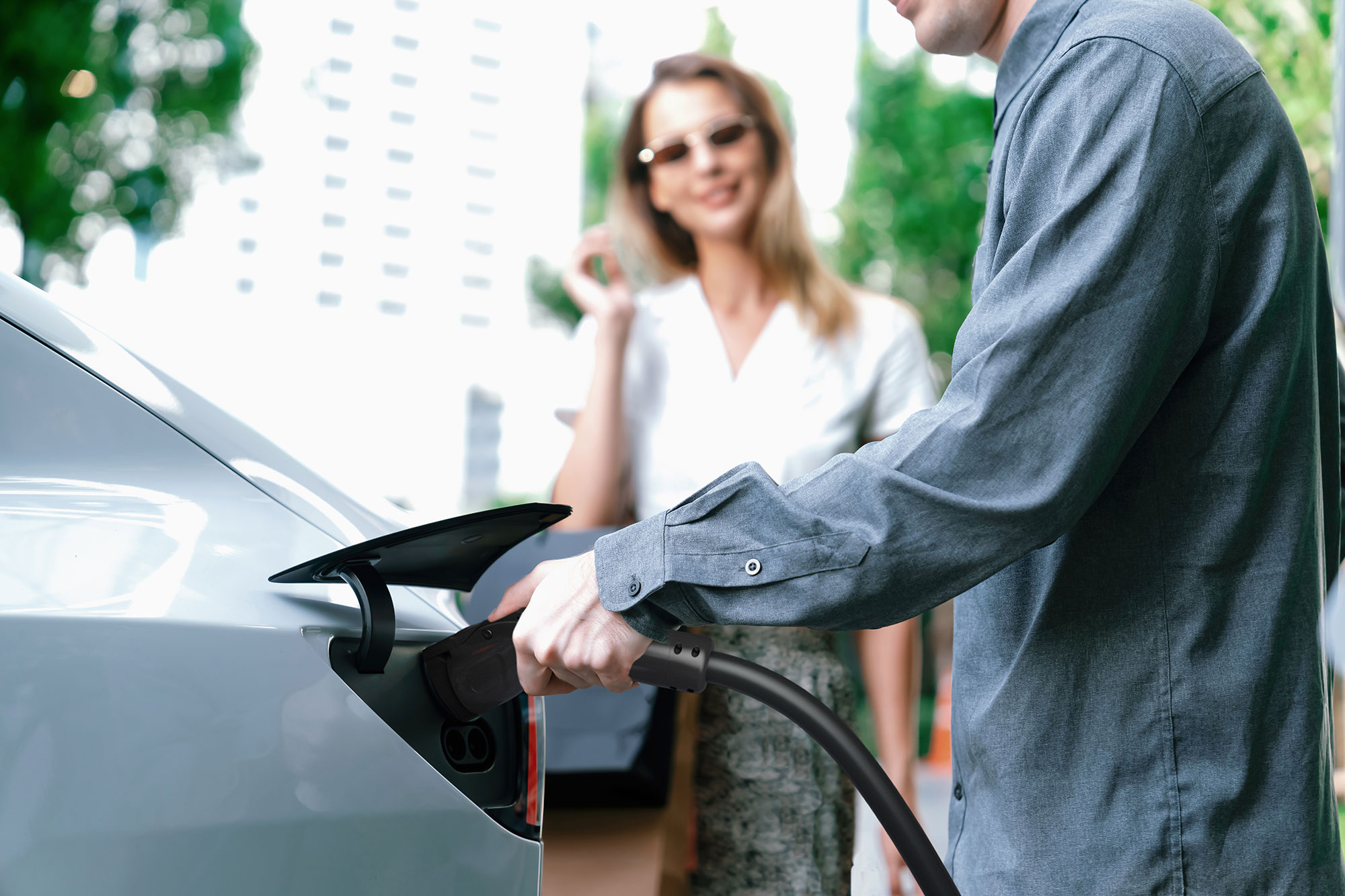 Driver charging an EV with an MSI ev charging station