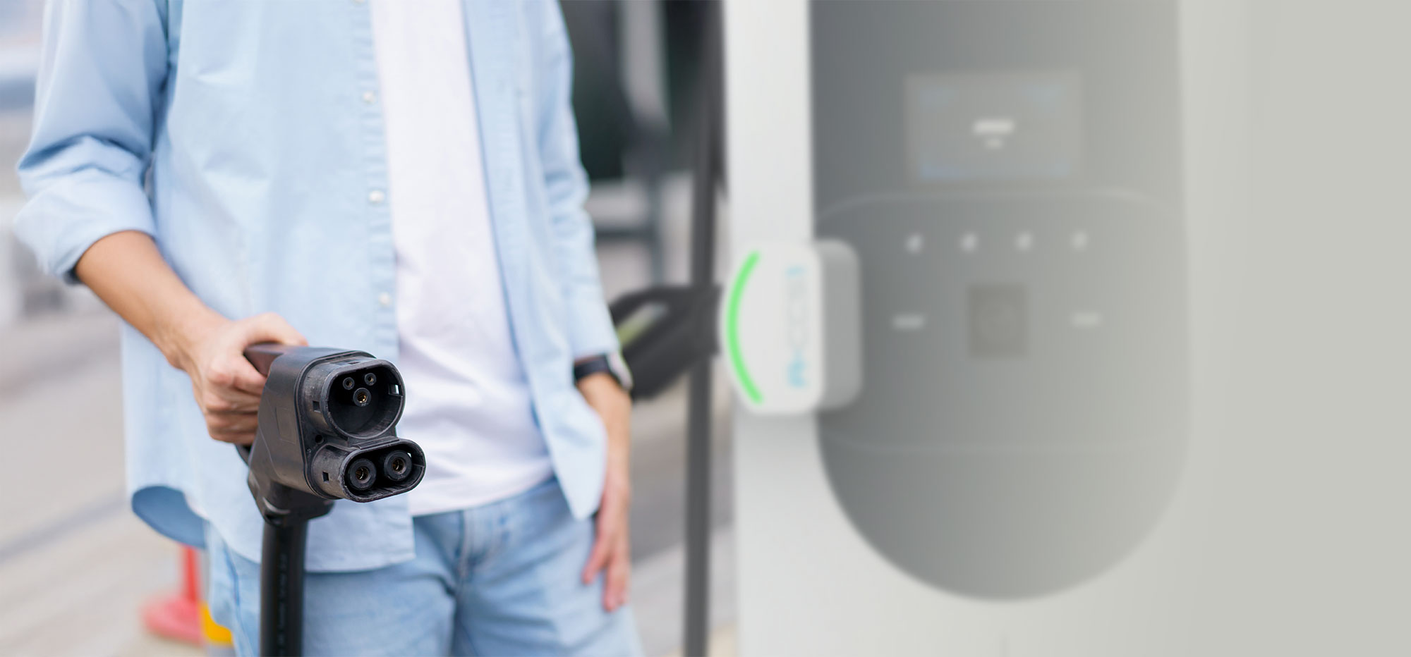 Fleet driver getting ready to plug in at an MSI DC charger for rapid charging.