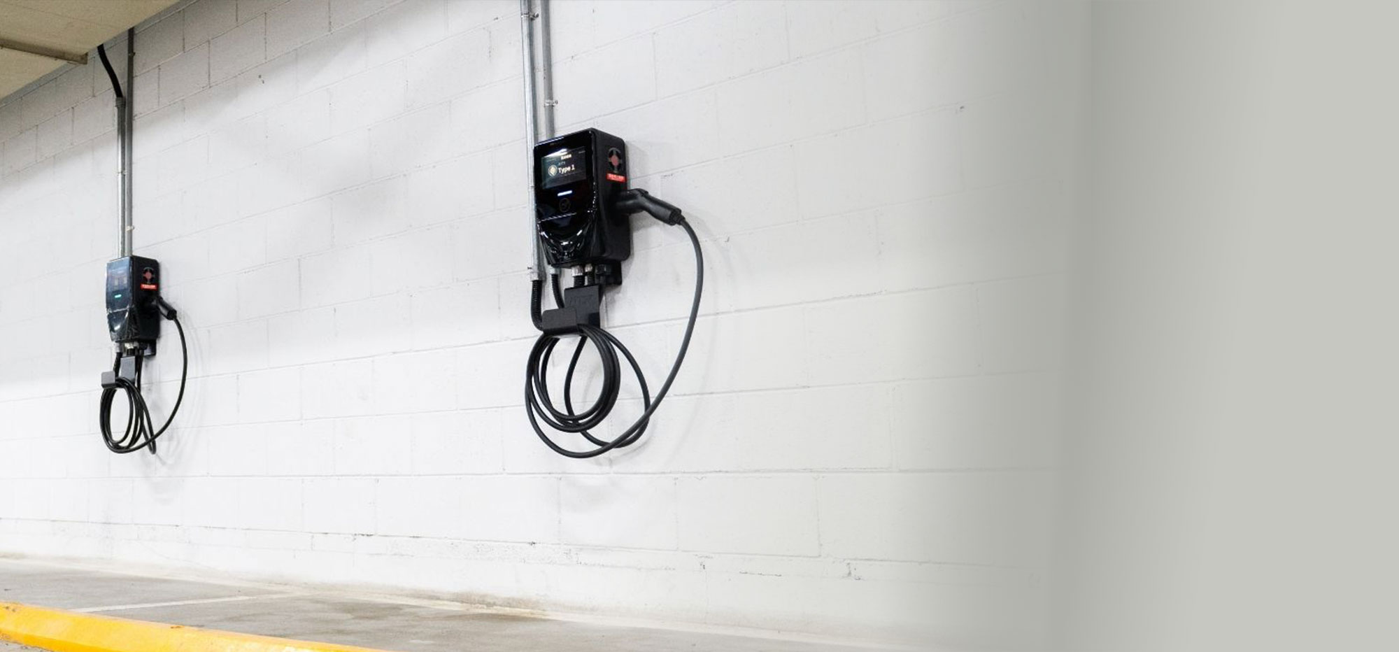 MSI EV chargers installed in an underground parking lot, offering more chargers with load management for cost savings.