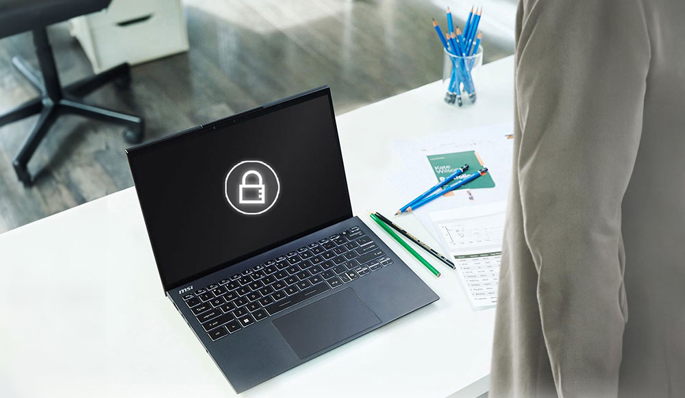 A laptop with a locked screen icon on its display, placed on a desk.